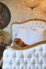 Antique Gold & Tufted White Bed